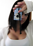 Sexy teen taking pics of her goodies in the mirror