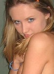 Shy blonde teen teasing the camera with tiny tits