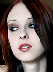 redhead cutie with pale skin undressing and posing
